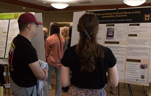Student presenting their poster at the 2022 Spring Forum