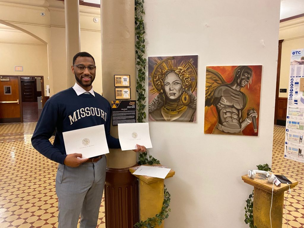 Portrait of Tyree Taylor in front of is 2020 VADS display