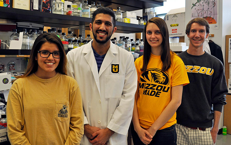 Dallas Pineda, Edward Duqum, Katie Wilsdon and Nathan Coffey in a science lab